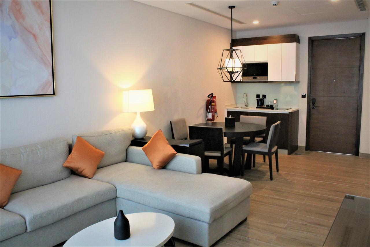 Millennium Resort Salalah Exterior foto A living room with a kitchen